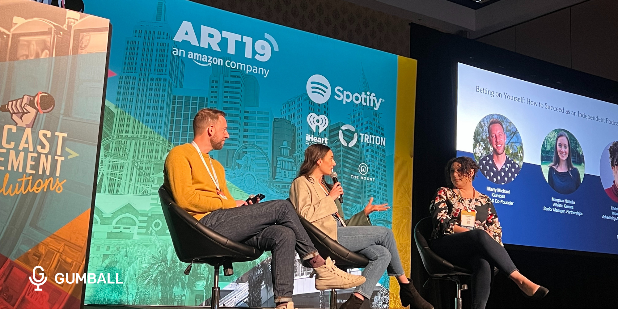 Marty Michael, Margaux Natiello, and Christina Fauth on stage for a panel at Podcast Movement Evolutions